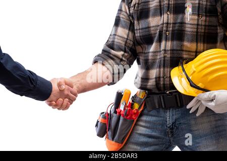 Close-up of a handshake of the electrician carpenter holding helmet and protective goggles in hand. Construction industry, electrical system. Isolated Stock Photo