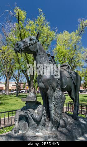 Cowboy at Rest bronze statue, 1990, based on smaller version created by Solon Hannibal Borglum in 1904, at Courthouse Plaza in Prescott, Arizona, USA Stock Photo