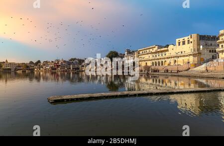 Pushkar Lake near Ajmer Rajasthan at sunset with ancient buildings Stock Photo