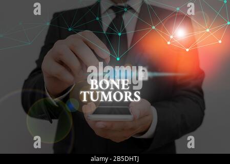 Conceptual Hand Writing Showing Bone Tumors Concept Meaning Can Be Either Benign Or Malignant Growths Found In The Bone Stock Photo Alamy