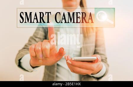 Writing note showing Smart Camera. Business concept for individual image processing systems designed to automate Stock Photo