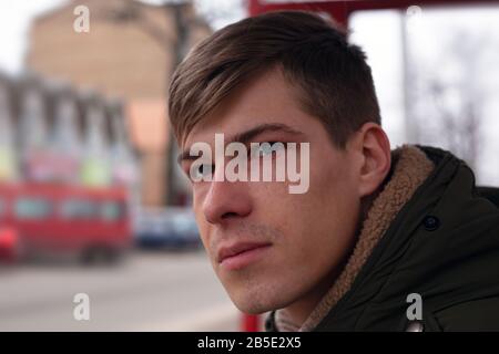 portrait of a young man at the stop. tired, sad face close-up. Stock Photo