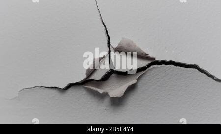 Old white cracked plaster wall surface for background or texture Stock Photo