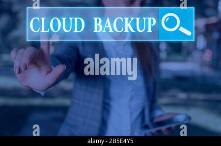 Word writing text Cloud Backup. Business photo showcasing enable customers to remotely access the provider s is services Stock Photo