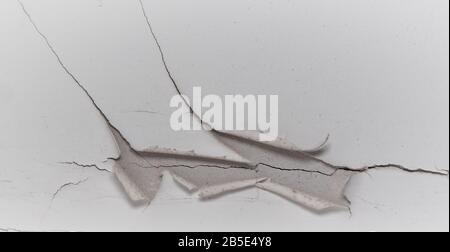 Old white cracked plaster wall surface for background or texture Stock Photo