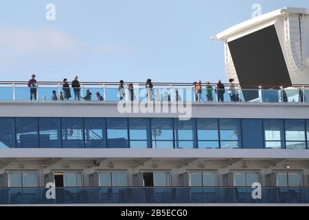 (200308) -- BEIJING , March 8, 2020 (Xinhua) -- Passengers are seen on the deck of 'Diamond Princess', a cruise ship which has been kept in quarantine at the port of Yokohama in Japan, Feb. 19, 2020. (Xinhua/Du Xiaoyi) Stock Photo