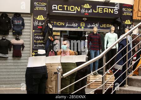 Mannequins with face masks displayed outside a clothing shop, in Gaza Strip, to spread awareness about COVID-19 coronavirus disease, on March 8, 2020, Stock Photo