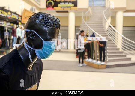 Mannequins with face masks displayed outside a clothing shop, in Gaza Strip, to spread awareness about COVID-19 coronavirus disease, on March 8, 2020, Stock Photo