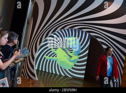 Wellington, New Zealand. 8th Mar, 2020. People visit the exhibition 'Wonderland' at the Te Papa National Museum in Wellington, New Zealand, March 8, 2020. The three-month exhibition 'Wonderland' ended on Sunday, which displayed more than 300 objects and props related to the famous British literature 'Alice in Wonderland'. Credit: Guo Lei/Xinhua/Alamy Live News Stock Photo