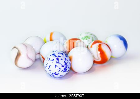 Colourful glass marbles isolated on white background. Stock Photo