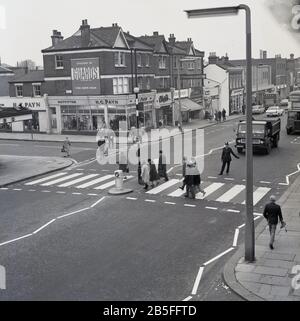 1960s, historical, Eltham High Street, South London, people crossing ...