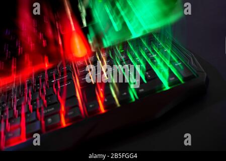 Gaming keyboard abstract led lights technology with led lights leak on black background Stock Photo