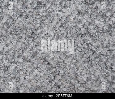 Warm soft fluffy woolen knitted fabric material texture background. Stock Photo