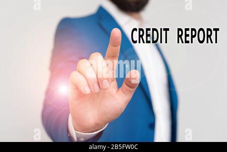 Writing note showing Credit Report. Business concept for it is the detailed report of an individual credit history Businessman blue suite and white sh Stock Photo