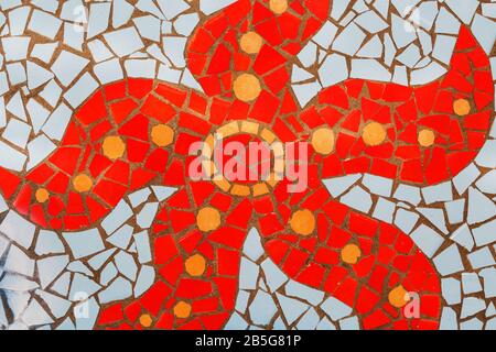 Detail of a multicolored glass mosaic. Red starfish on a blue background Stock Photo
