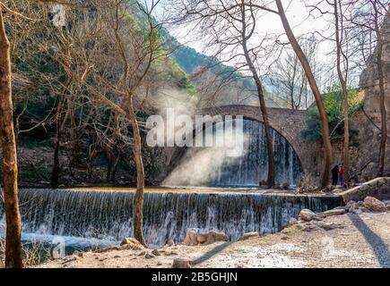 The artificial waterfalls and the medieval stone bridge of Palaiokarya, in Trikala, Thessaly, Greece Stock Photo