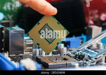 Electronic engineer of computer technology. Maintenance computer cpu hardware upgrade of motherboard component. Pc repair, technician and industry sup Stock Photo