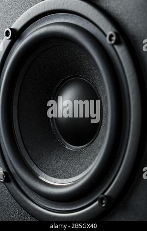 Speaker system speakers in close-up on a black background. Round, black speaker Stock Photo