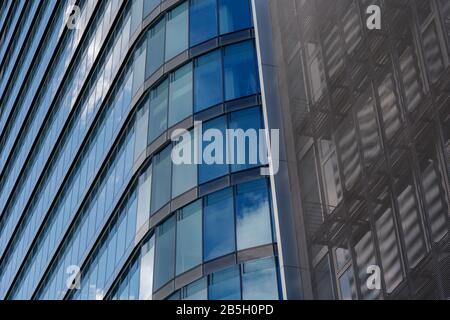 Exterior architectural detail of mixture facade elements and material of modern office buildings. Abstract Urban metropolis background. Stock Photo