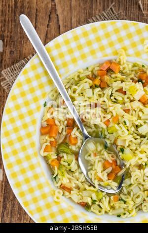 Portion of homemade Alphabet Soup (selective focus; close-up shot) Stock Photo