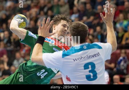 08 March 2020, Baden-Wuerttemberg, Stuttgart: Handball: Bundesliga, TVB Stuttgart - SC Magdeburg, 27th matchday. Magdeburg's Michael Damgaard (l) in action with Stuttgart's Max Häfner. Photo: Marijan Murat/dpa Stock Photo