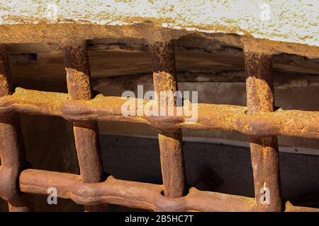 thick bars of rusty iron in a window Stock Photo