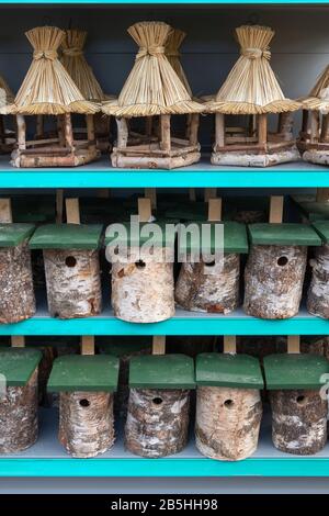 Wooden bird houses for sale in spring at the market Stock Photo