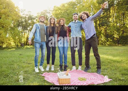 Young people play together in the park in their free time. Stock Photo