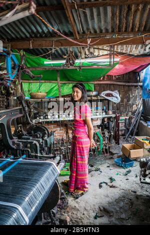 Local people working with loom, Mandalay, Myanmar, Asia. Stock Photo