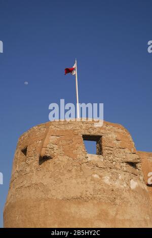 Arad Fort with the Bahrain flag flying, Muharraq, Kingdom of Bahrain Stock Photo