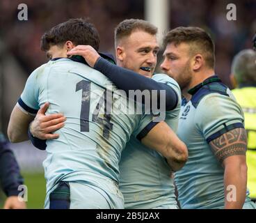 BT Murrayfield Stadium, Edinburgh, Scotland, UK. 8th March, 2020. ScotlandÕs Stuart Hogg congratulates Sean Maitland (14) after he scored his and Scotland's second try. Credit: Ian Rutherford/Alamy Live News. Stock Photo