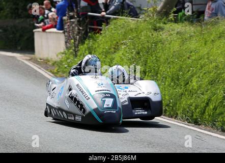 Ben and Tom Birchall at the top of Barregarrow on their way to winning the 2019 Isle of Man Sidecar TT race. Stock Photo