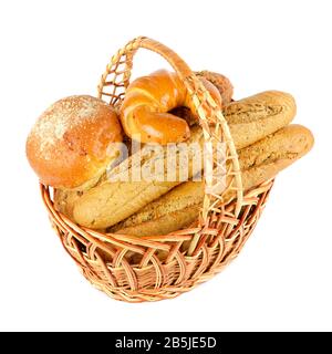 Fresh baguette, bun, croissant in big basket isolated on white background Stock Photo