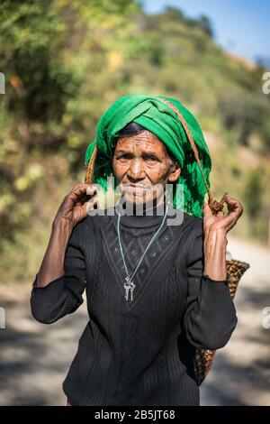 Local woman with tattooed face from village Mindat, Chin state, Myanmar, Asia. Stock Photo