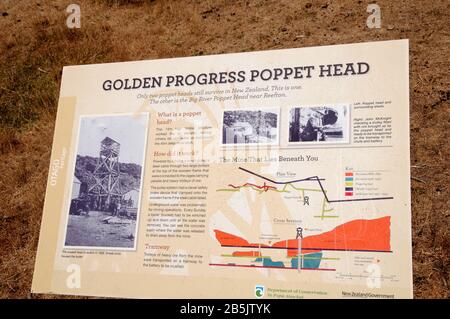An information panel, installed by the Dept. of Conservation at the Golden Progress Mine, an old gold mine in the Central Otago Goldfield, New Zealand Stock Photo