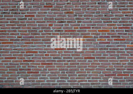 Real vintage beautiful bumpy, rough and old brick texture with Running Bond pattern. Stock Photo