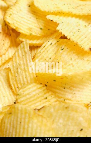 A vertical stack of grooved chips. Close up. Stock Photo