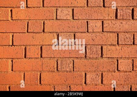 Texture and background of brick with red paint. Close up. Stock Photo
