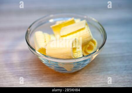 Butter parsley on a wooden table in a bowl Stock Photo