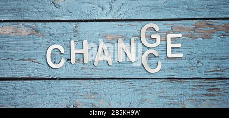 Word change to chance in letters on light blue wooden background. Personal development career growth or change yourself concept Stock Photo