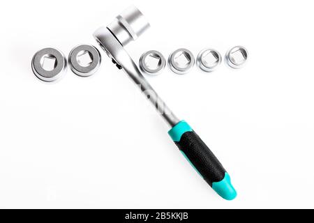 Steel made no skid threaded handle hold firmly without slipping. Universal socket sets. Can be used in hard to reach places. Knob for socket wrench nut ratchet close up. Ratchet tool. Ratchet wrench. Stock Photo