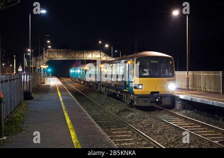 Transport for Wales class 143 sprinter train 143616 + class 150 sprinter 150254 calling at  Pengam railway station (Rhymney valley line, south Wales) Stock Photo