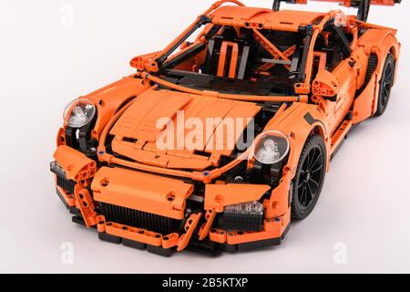 Different views of assembled orange lego Porsche GT 3RS car Stock Photo