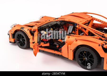 Different views of assembled orange lego Porsche GT 3RS car Stock Photo