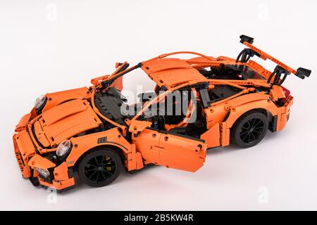 Different views of assembled orange lego Porsche GT 3RS car Stock Photo