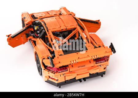 Different views of assembled orange lego Porsche GT 3RS car Stock Photo