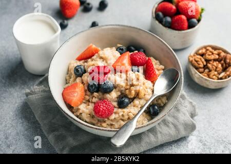 Healthy Oatmeal Porridge With Summer Berries Blueberry Raspberry Strawberry In A Bowl. Clean Eating Concept Stock Photo