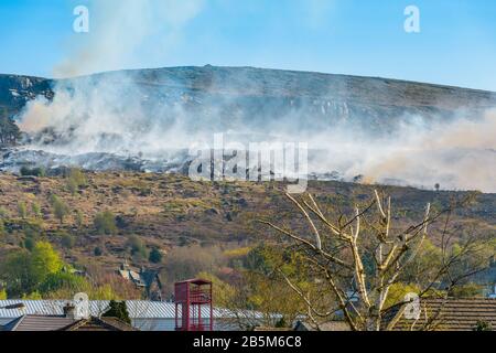 Firefighters tackling fire on Ilkley Moor, West Yorkshire in the evening of 20 April 2019 after an unusually hot day. Stock Photo