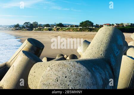 Concrete blocks protecting the jetty of Santa Cruz Harbor calm