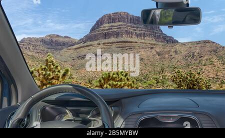 Looking through a car windshield with view of Spirit Mountain and joshua trees, Grand Canyon, Arizona, USA Stock Photo